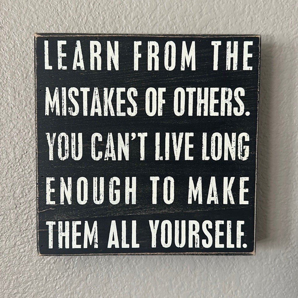 Black wooden sign - mistakes